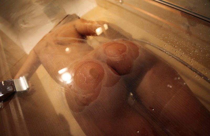 Girl in shower cabin nude, Pressed her ass against glass, Pressed with boobs to glass