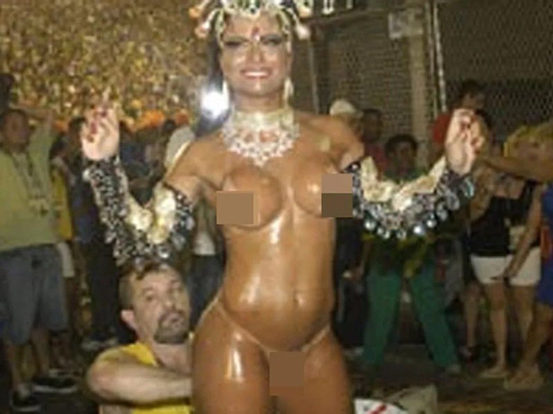 A woman in costume standing on stage, Naked carnival without panties, Brazilian carnival porn