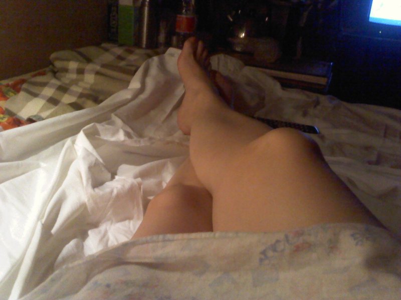 Amateur on the bed, Girl under a blanket with a chest, The legs of girls in bed
