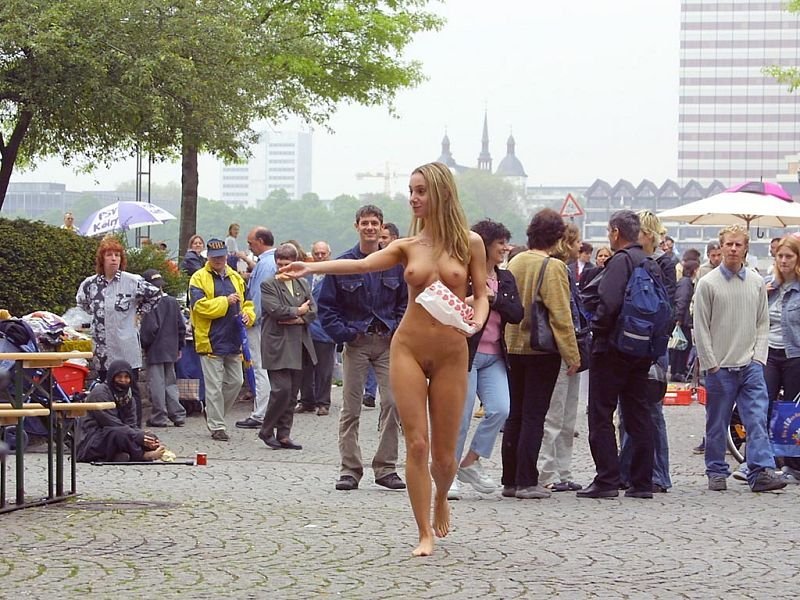 Girl naked among dressed, Naked girls on the streets, Naked in the crowd of dressed