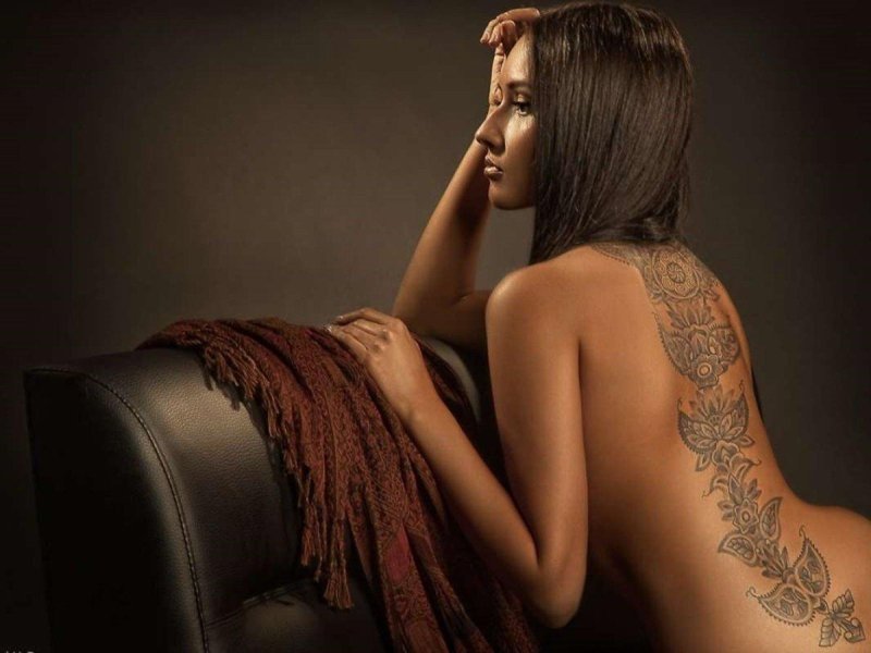 Beautiful tattoo, Tattoo on the body of a woman, Girl with a tattoo on her back